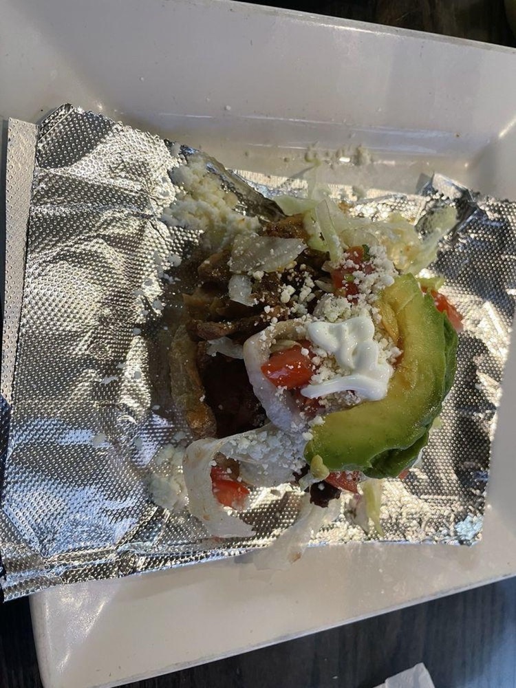 La Morenita’s sopes topped with lettuce, cheese, and avocado